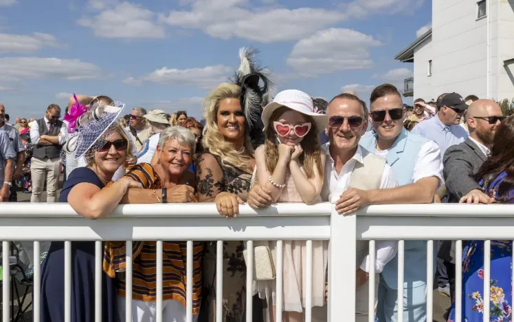 A family group at Ffos Las watch the races from the trackside